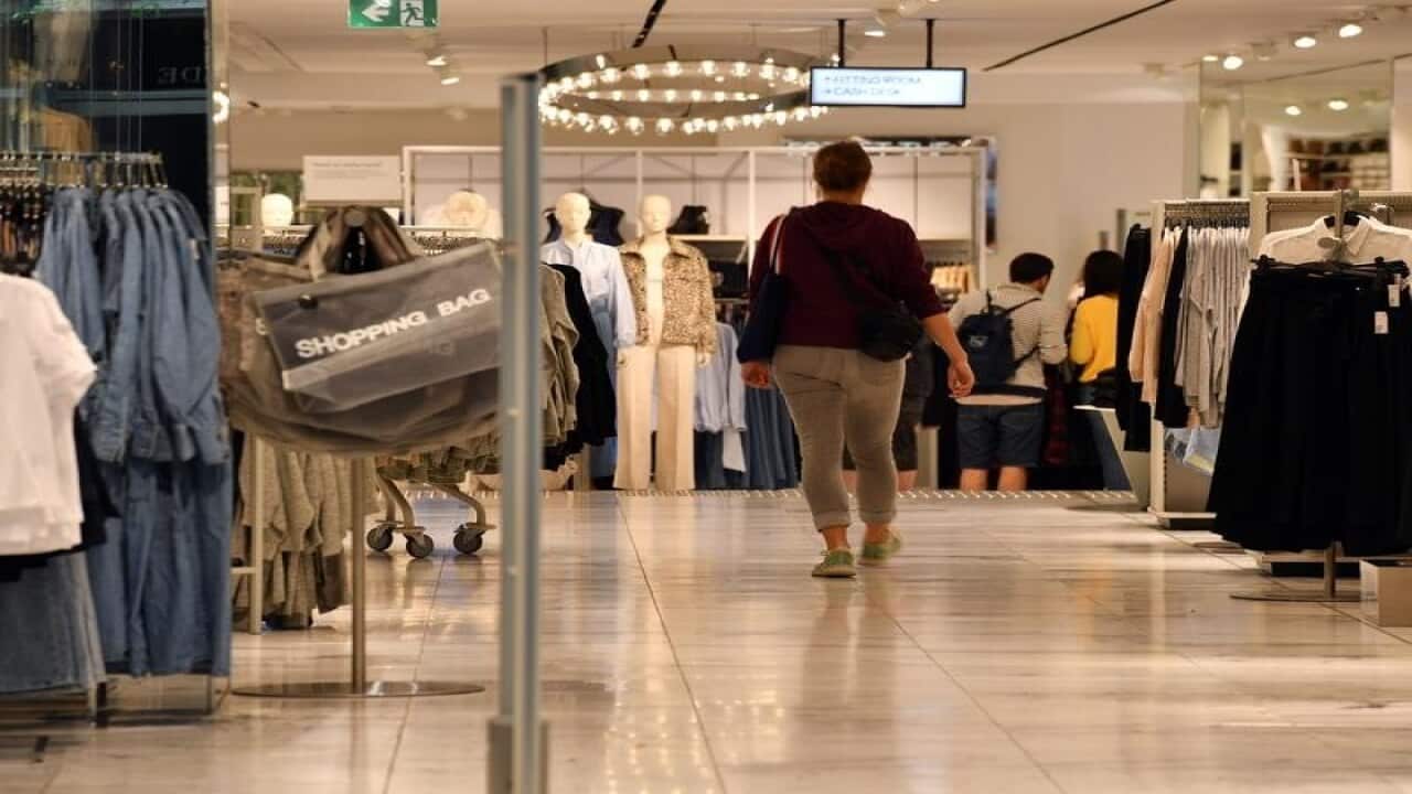 A shopper walks into a women's fashion store in Sydney.