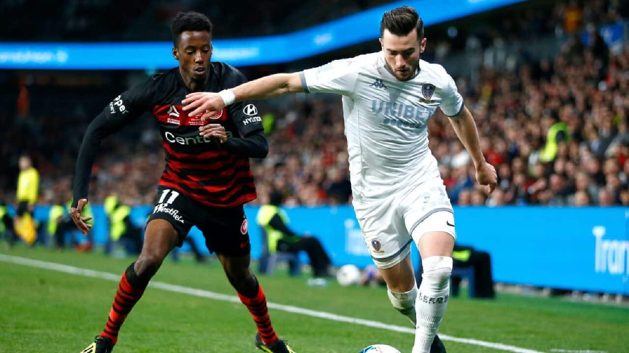 Bruce Kamau of the Wanderers battles Leeds United's Jack Harrison for the ball