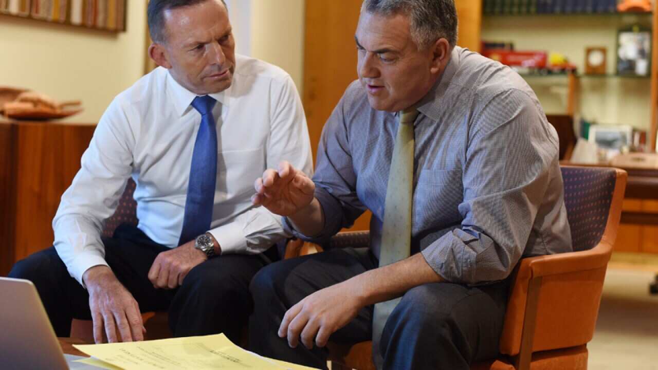 Australian Prime Minister Tony Abbott (left) and Treasurer Joe Hockey