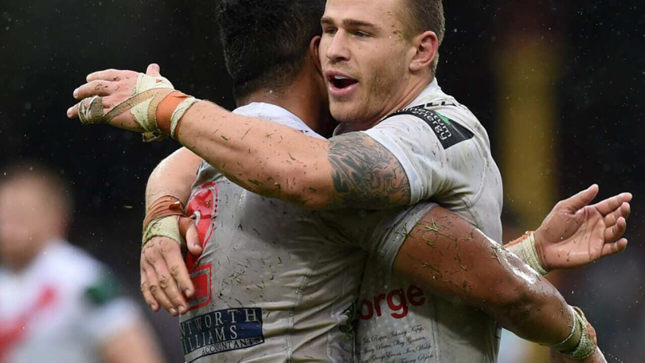 Euan Aitken (R) and Peter MataÕutia of the Dragons celebrate