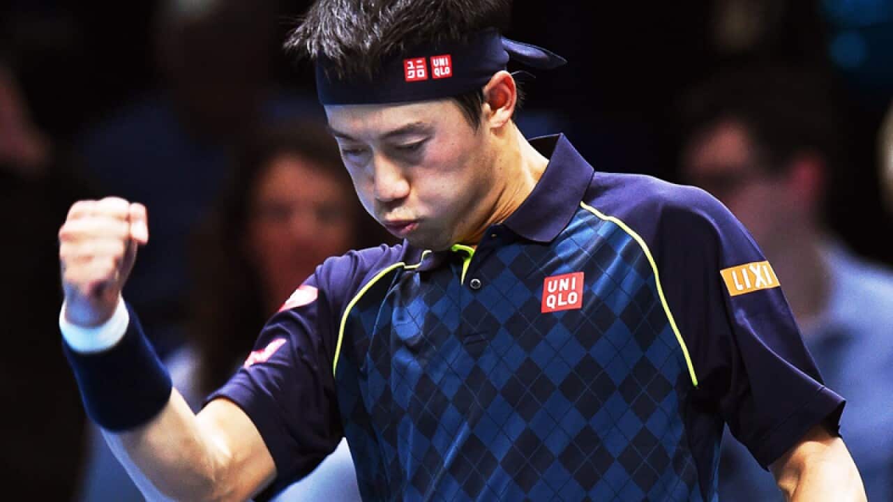 Japan's Kei Nishikori celebrates after defeating Tomas Berdych