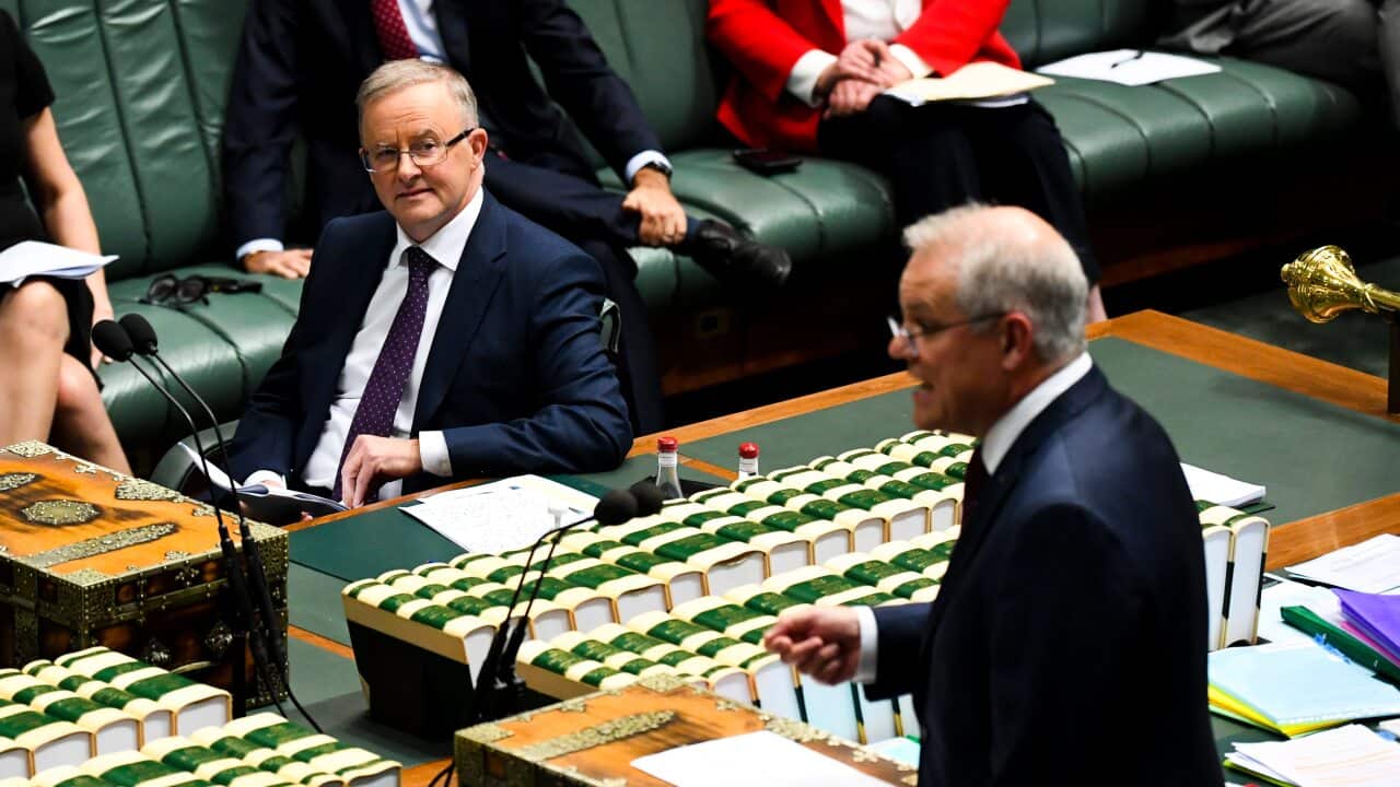 Opposition Leader Anthony Albanese (left) listens to Prime Minister Scott Morrison, May 26, 2021.