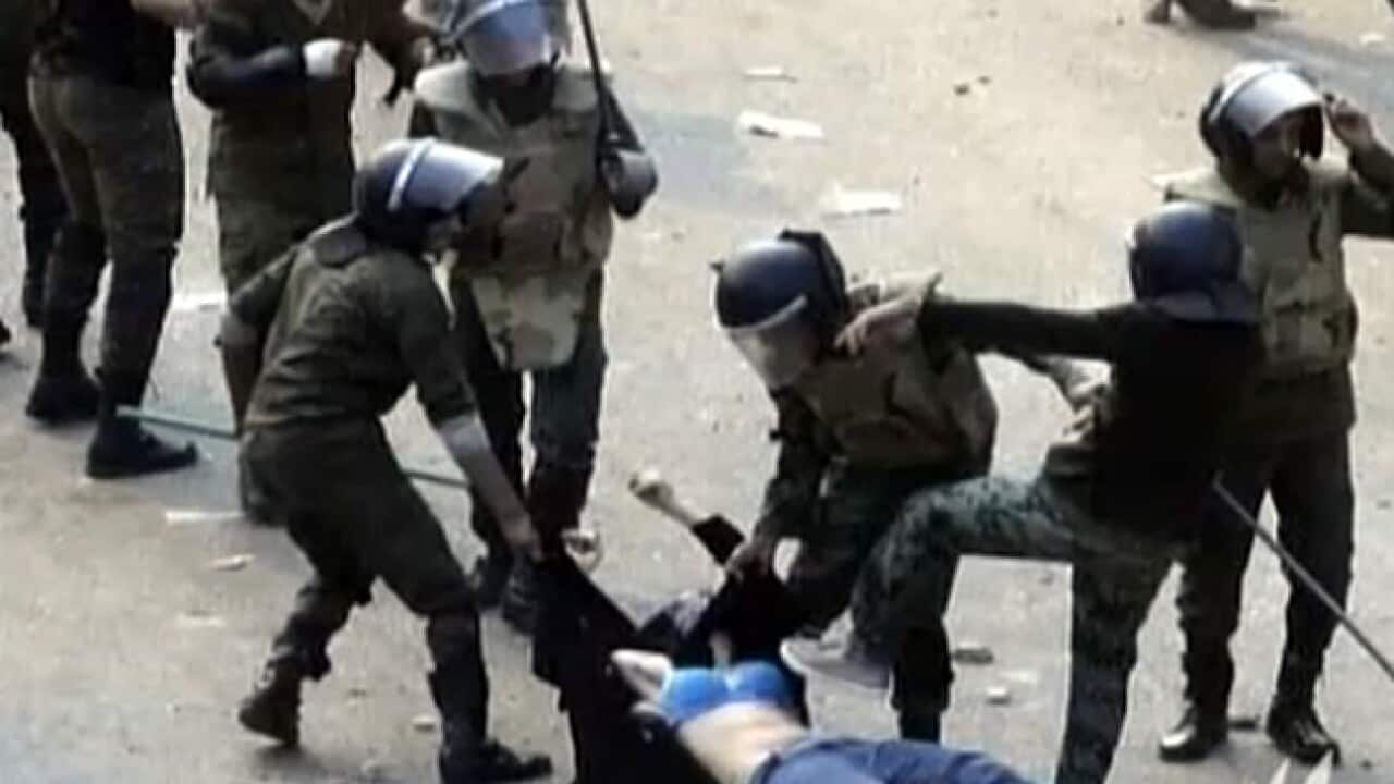 egypt_woman_beating_111221_sbs_1852749162