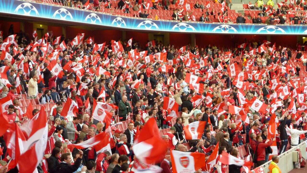 Soccer supporters - the match between Arsenal vs Manchester United