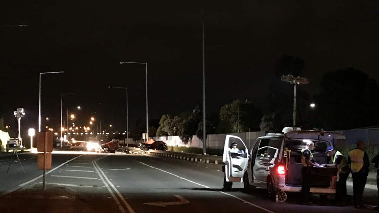 Police cordon off the scene of a car crash that left three people dead in Melbourne's west, Sunday, December 24, 2017.