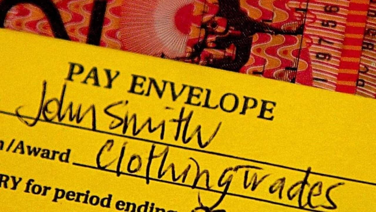 A standard pay packet showing twenty- and fifty-dollar notes.