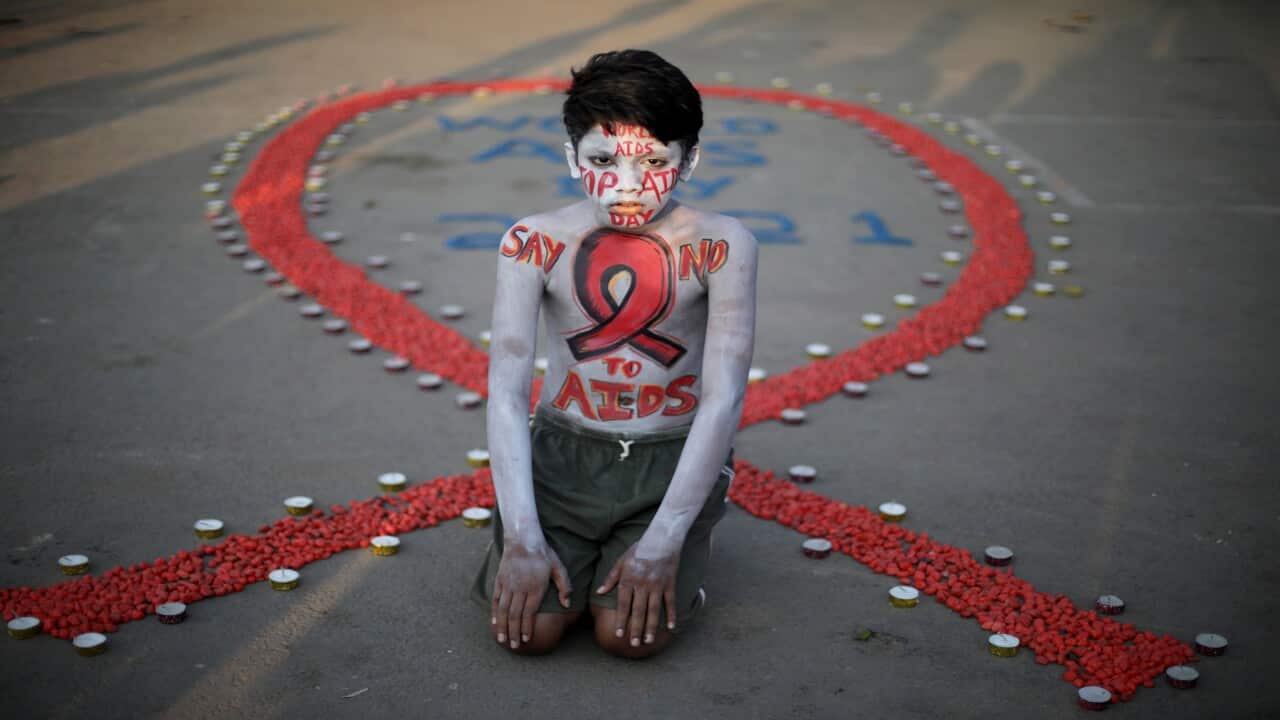 An activist poses during a campaign to mark World AIDS Day in Kolkata, India, 01 December 2021.