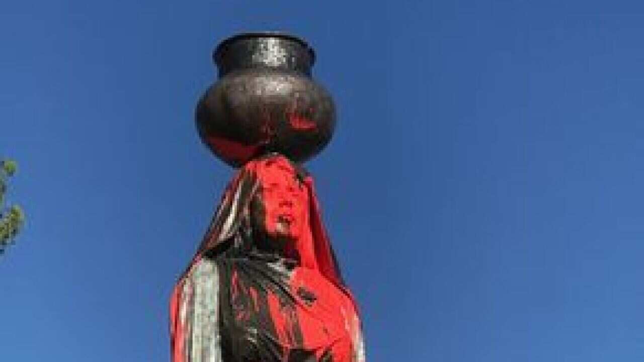 The statue was splattered in red paint and had the words 'Columbus Day' written on it.