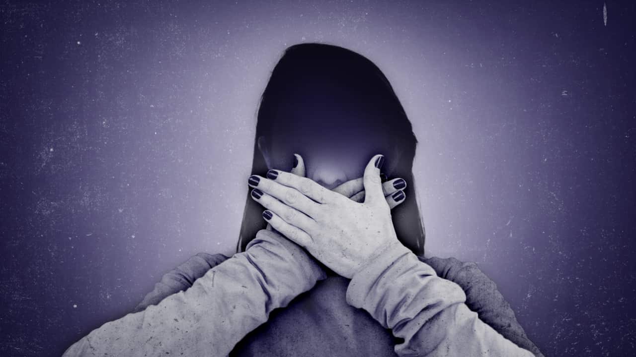 A visual represention of a person being gagged from speaking out. 