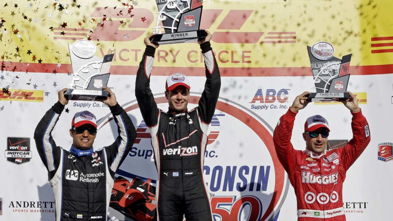 Australian IndyCar driver Will Power (C)