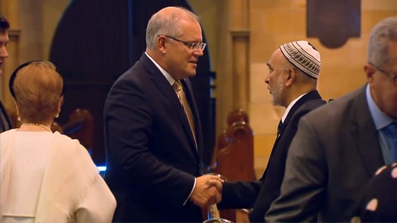 Prime Minister Scott Morrison in a show of solidarity with religious leaders at St Mary's Cathedral.
