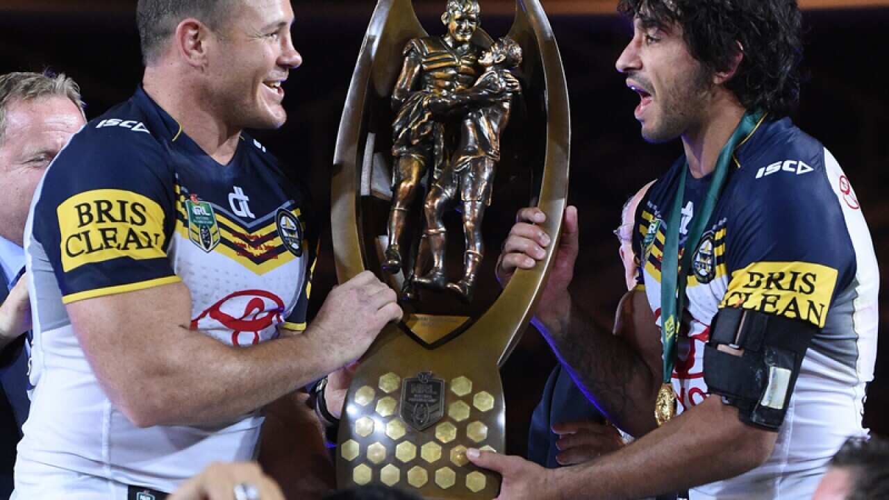 North Queensland's Matt Scott (L) and Johnathan Thurston