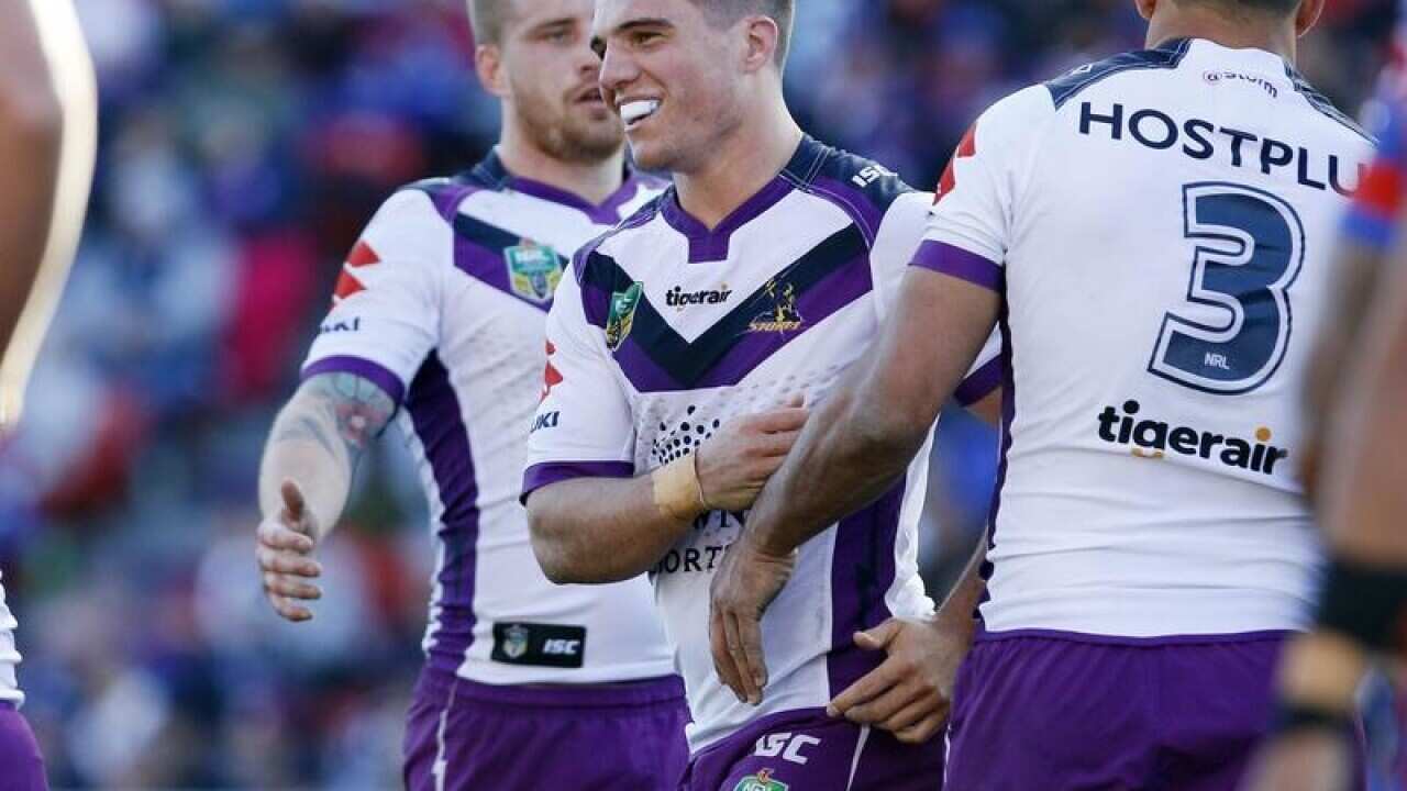 Brodie Croft of the Storm celebrates after scoring a try