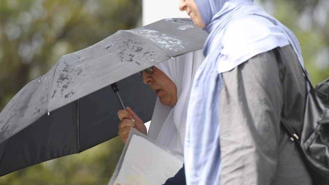 Maha Al-Shennag (L) leaves Bankstown Local Court
