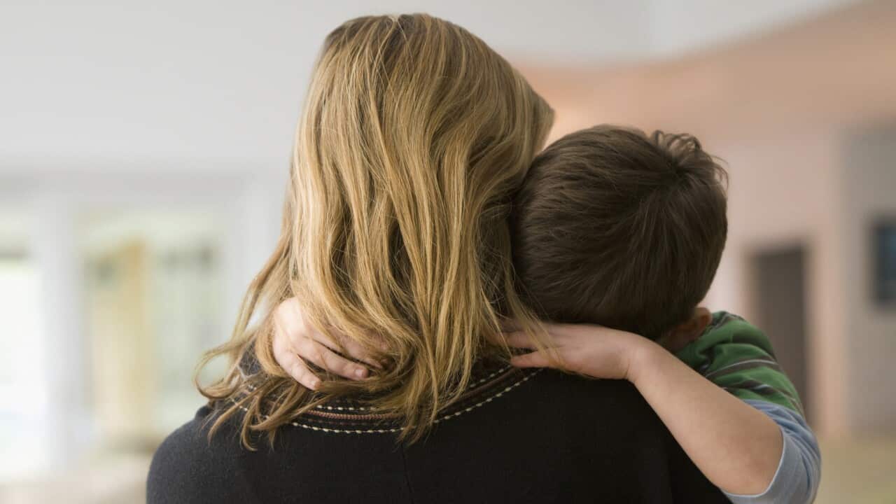 Caucasian mother comforting son
