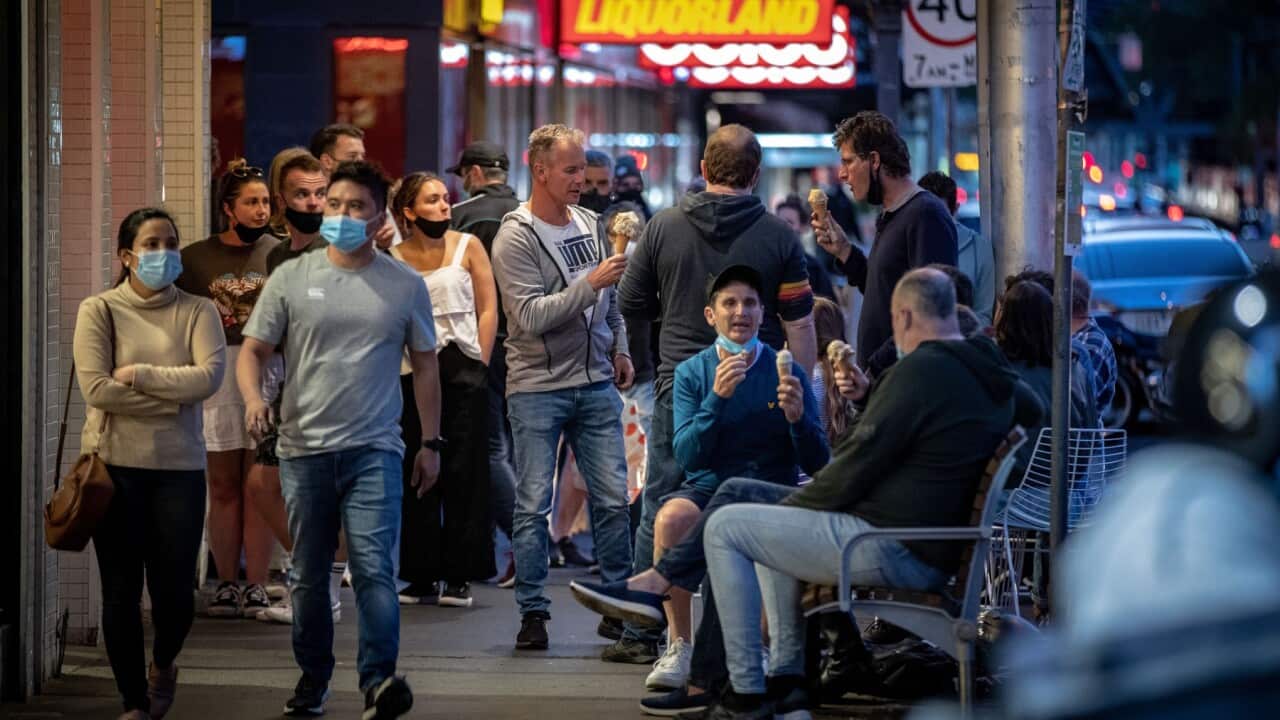 People enjoy outdoor eating on Swan Street in Richmond