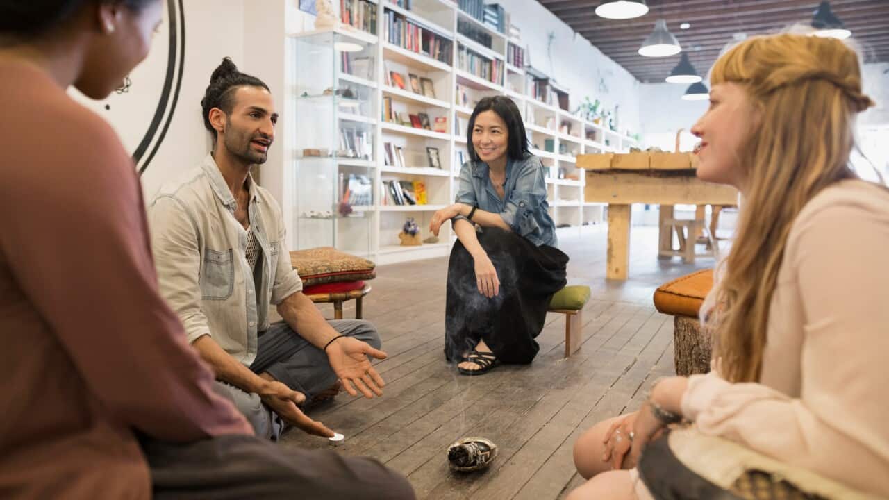 Man teaching meditation class