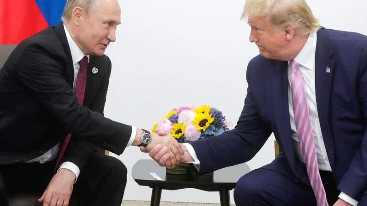 President Putin and President Trump shake hands in Osaka