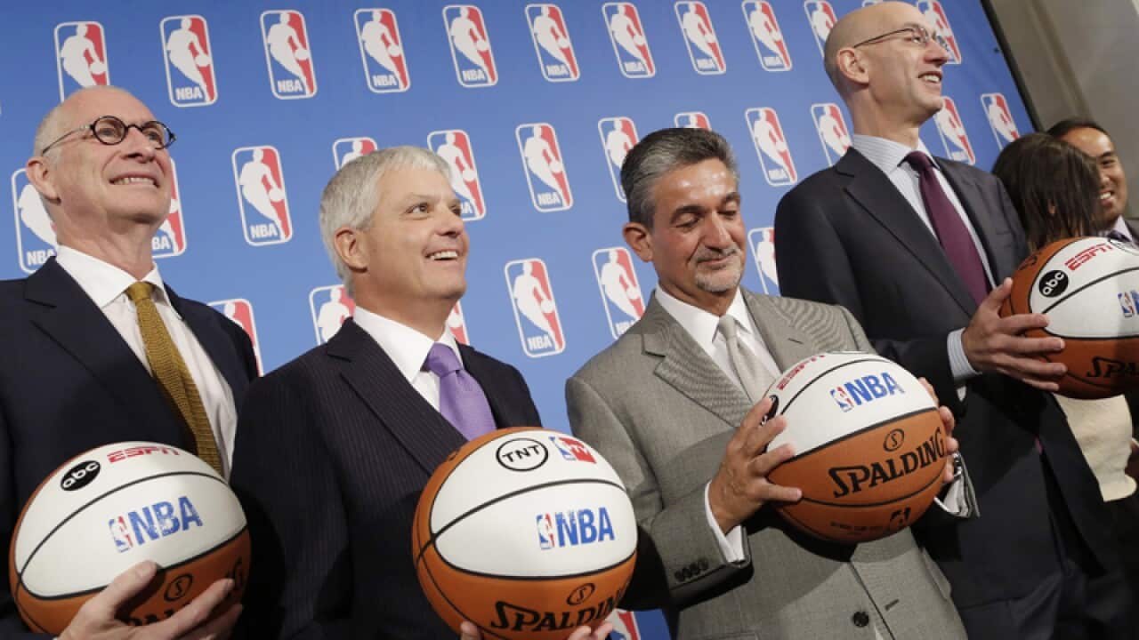 Officials during the announcement of NBA TV contract extensions