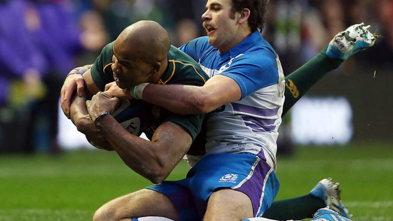 South Africa's JP Pietersen (L) scores a try against Scotland