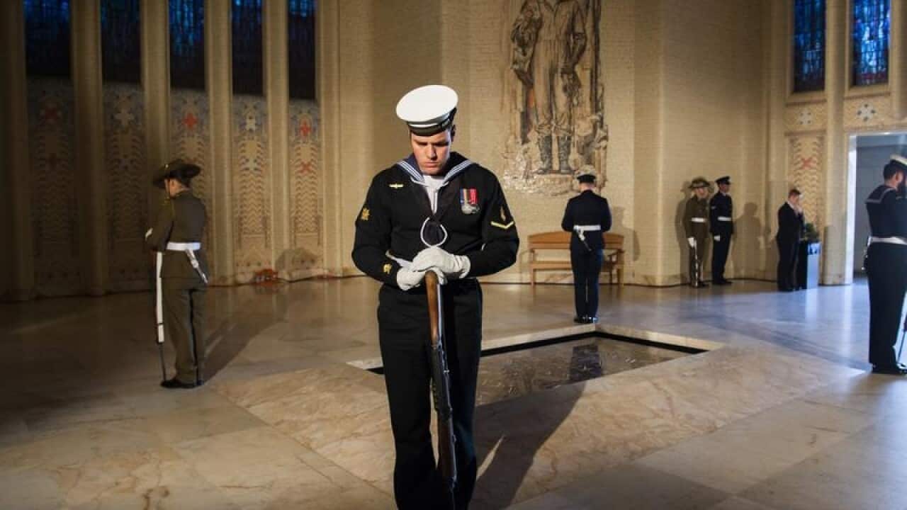 Soldiers guard the tomb of the unknown soldier at the War Memorial.