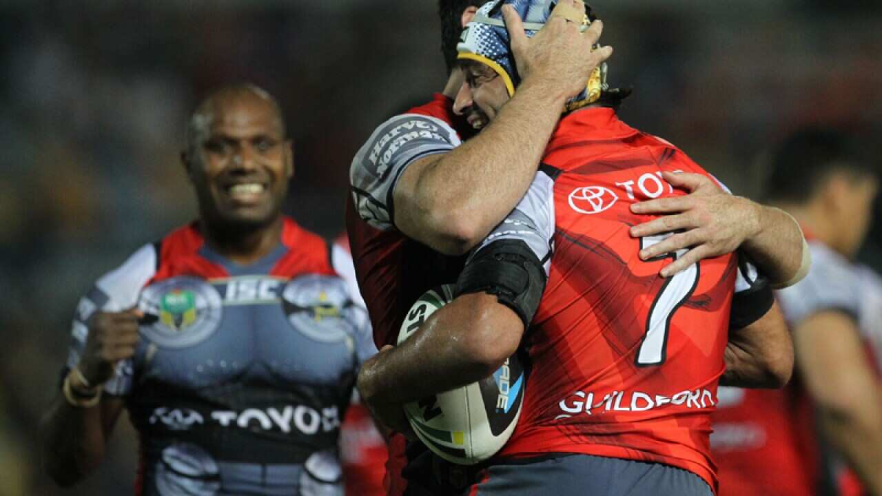 Johnathan Thurston hugged by Kane Linnett after scoring