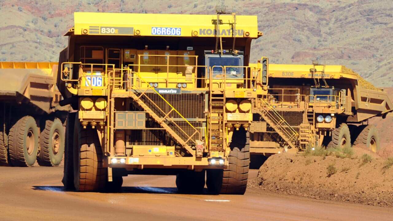 Haulage trucks at the Rio Tinto West Angelas iron ore mine