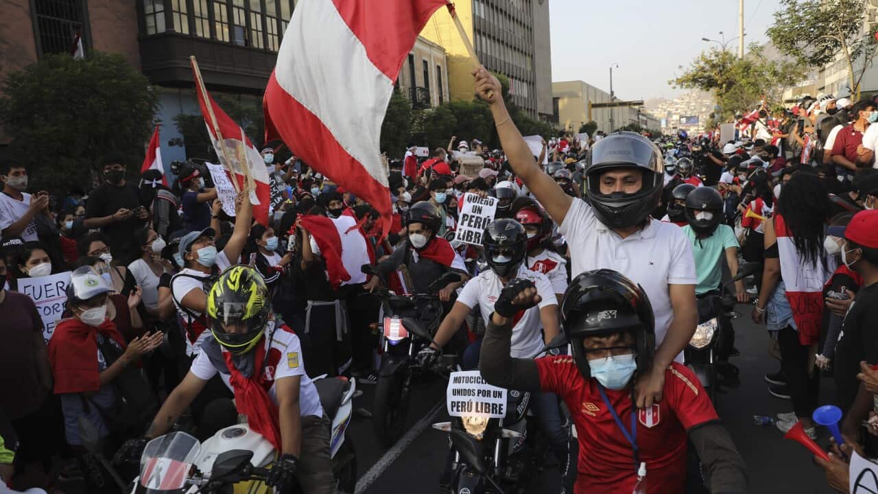 A caravan of demonstrators on motorcycles ride after interim President Manuel Merino resigned his post