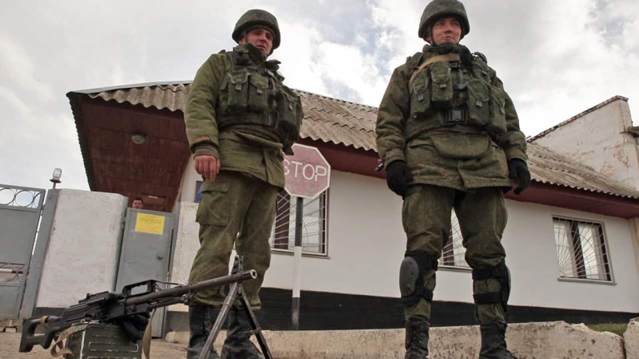 Unidentified armed men block Ukrainian military base in Crimea