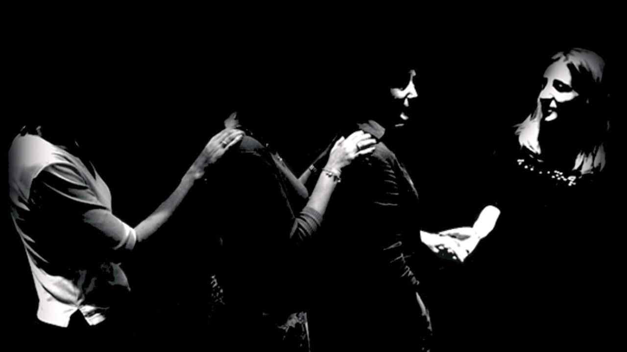 People queuing in the dark