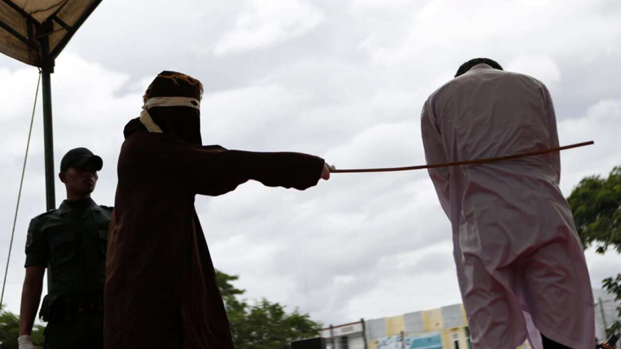 A man is whipped as punishment for being in a same-sex relationship