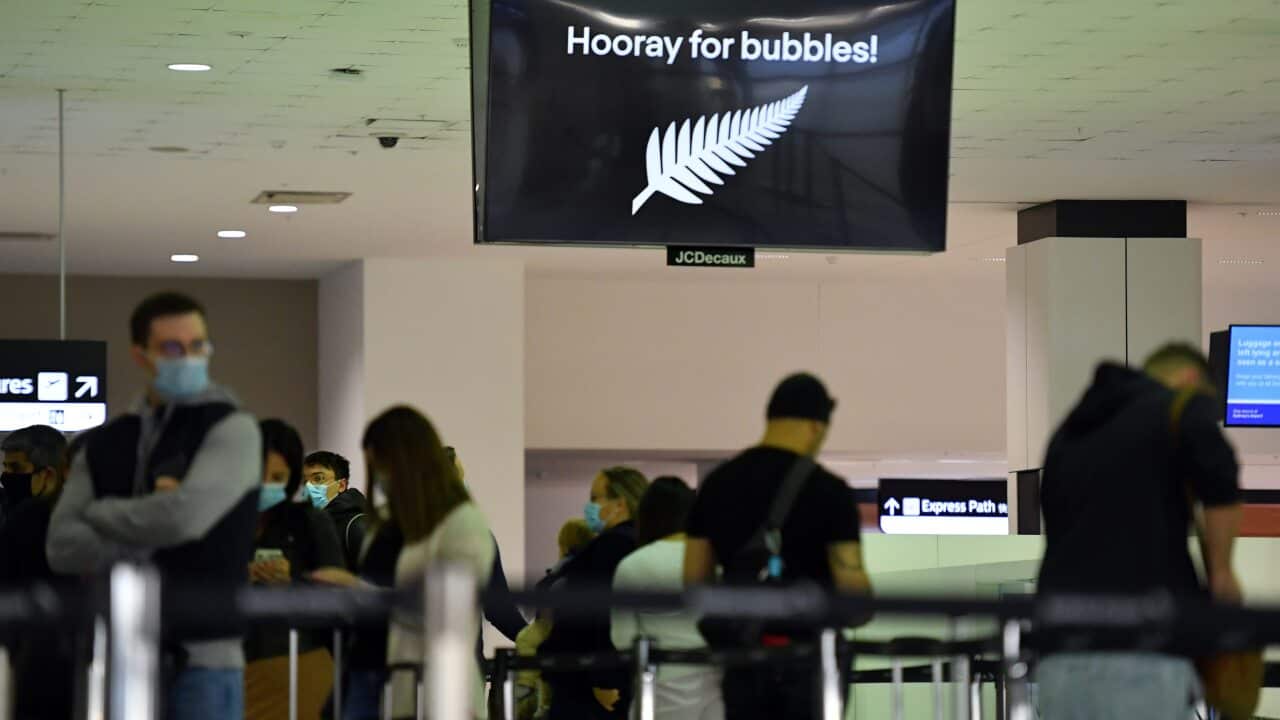 Departure passengers to New Zealand wait to check in at Sydney International Airport, Sydney, Monday, April 19, 2021.