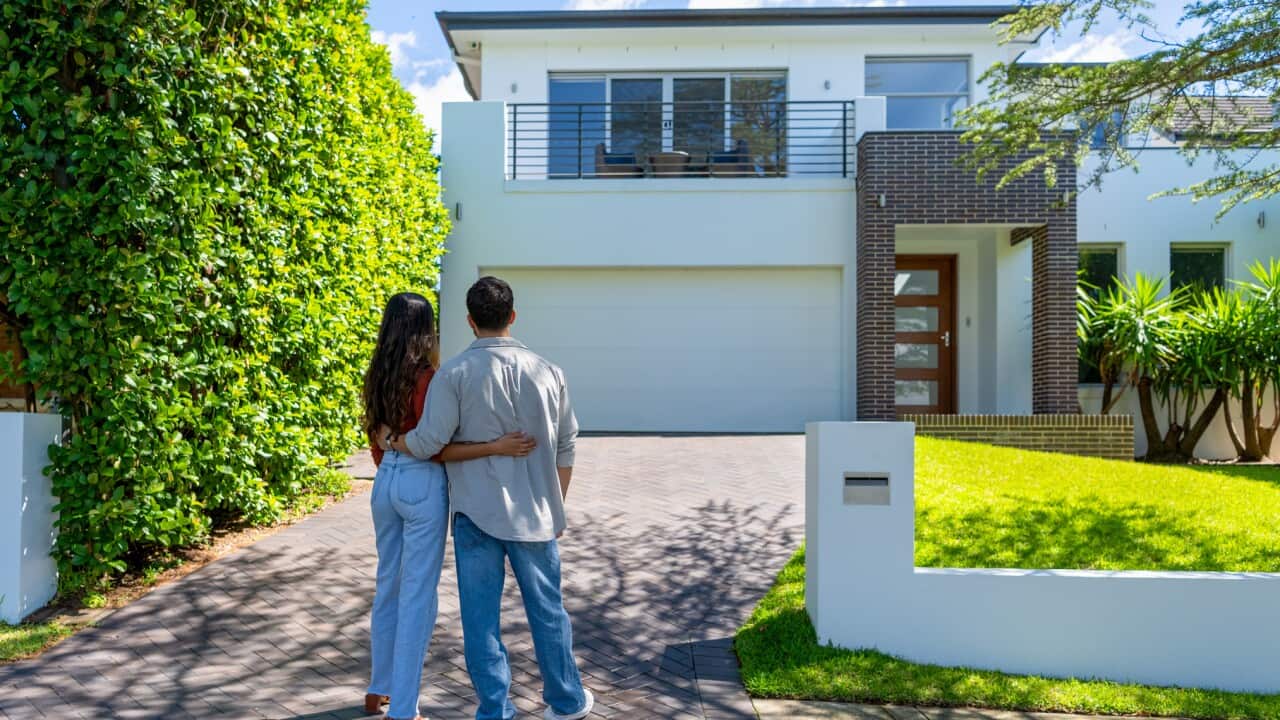 A representative image of a couple after purchasing their first home.