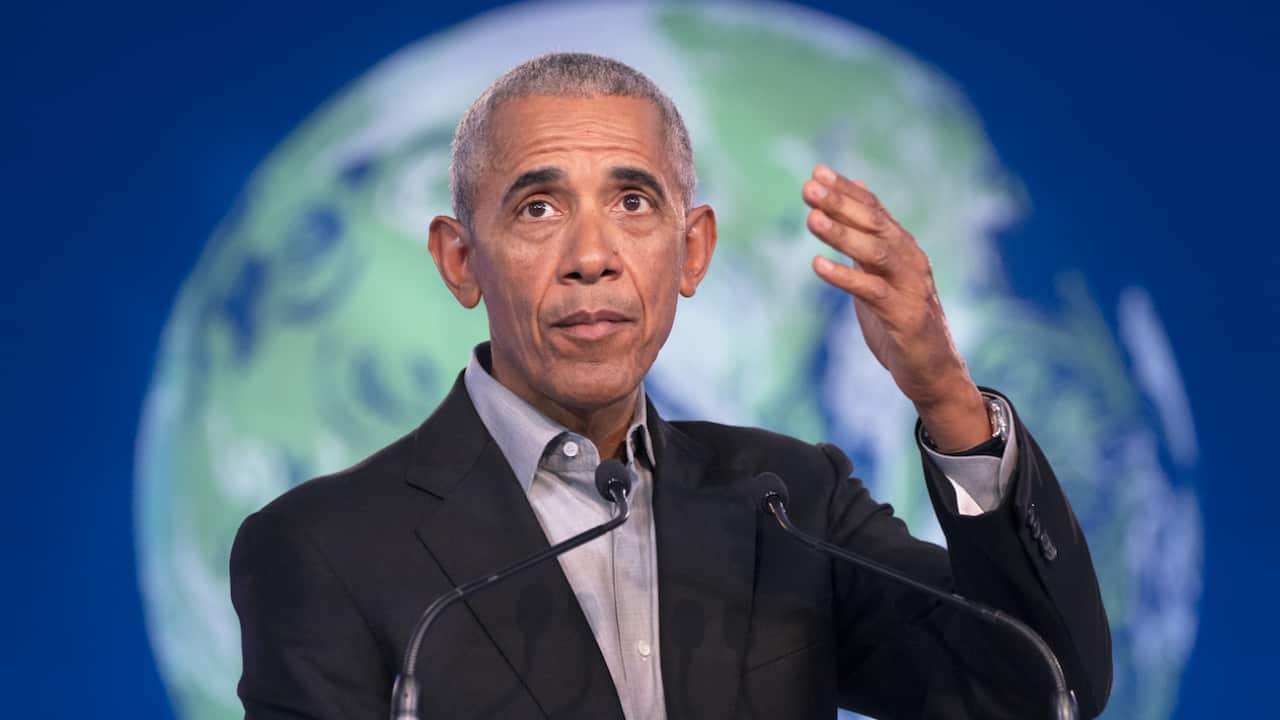 Former US president Barack Obama delivers a speech to delegates during the COP26 summit