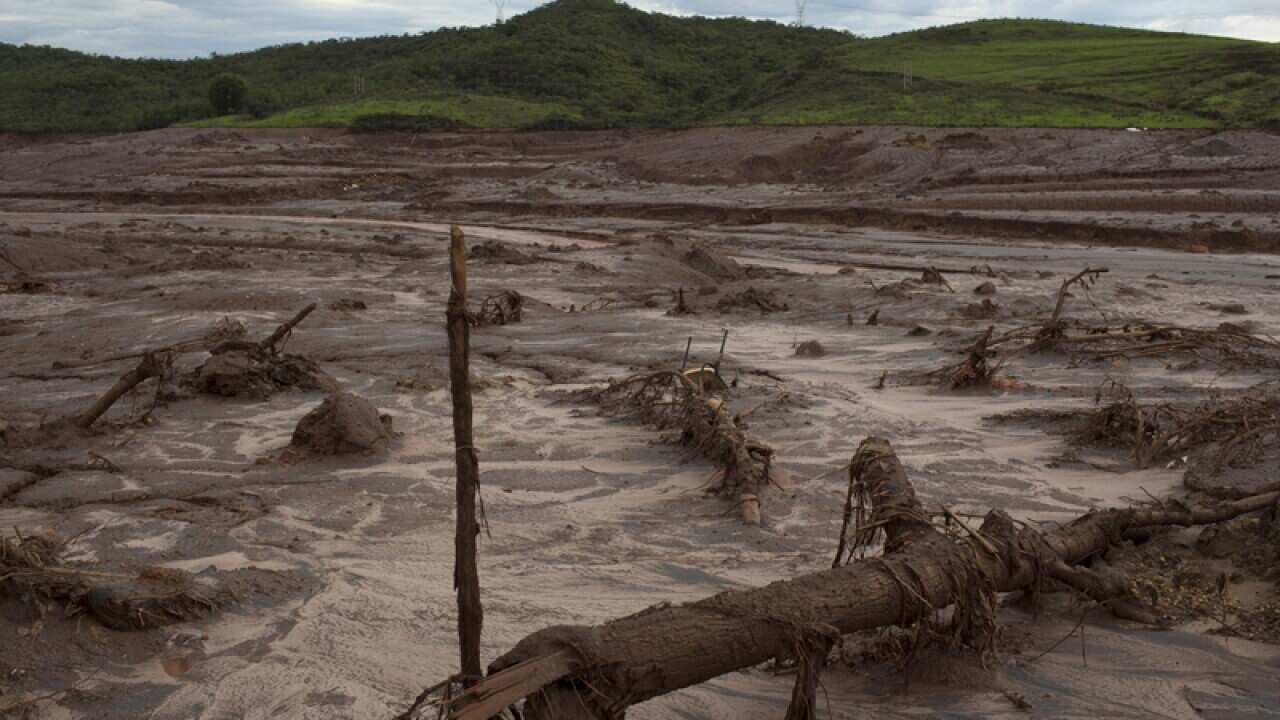 Debris awash in mud following a dam break in Brazil