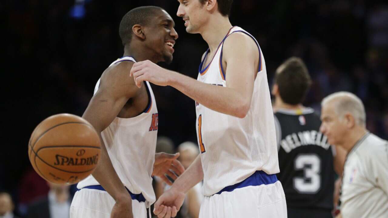 New York Knicks' Alexey Shved, right, and teammate Langston Galloway