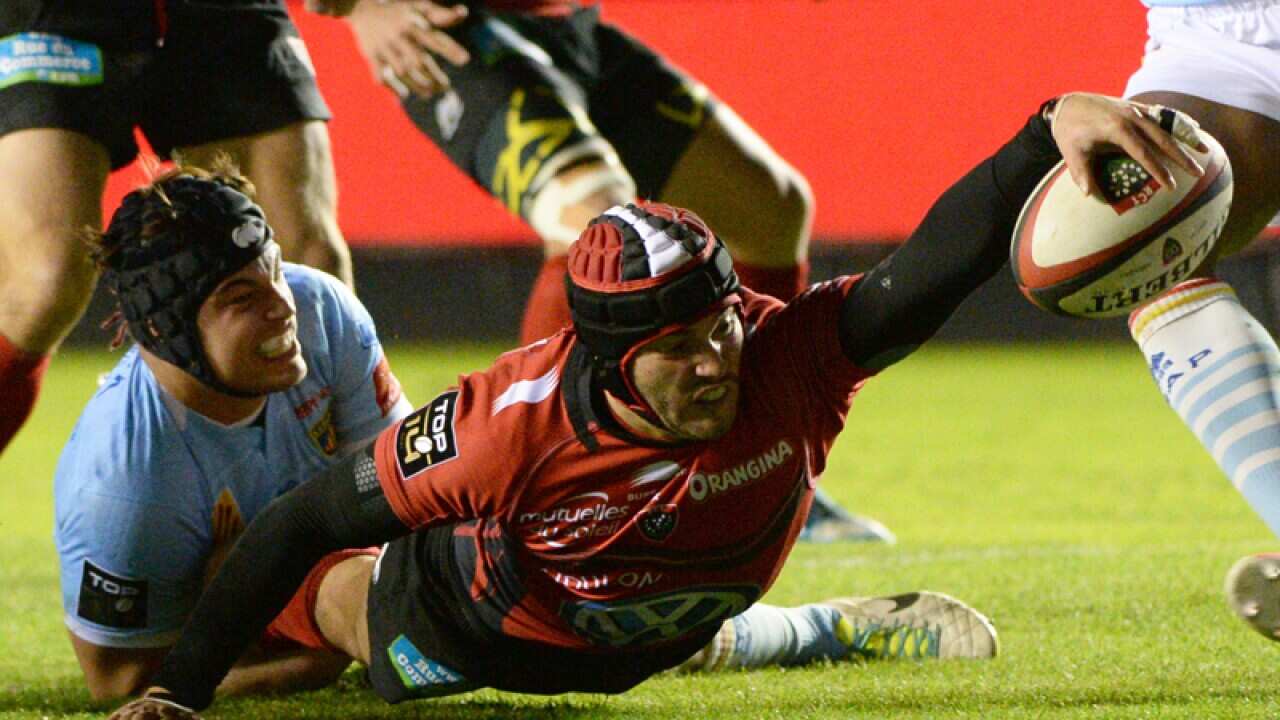 Toulon's Jocelino Suta vies with Perpignan's Bertrand Gury