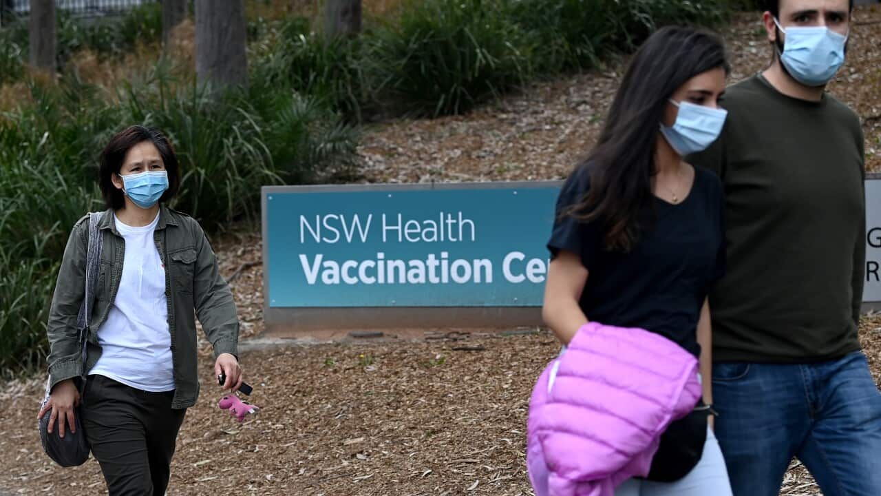 Members of the public line up at the NSW Health Vaccination Hub at Sydney's Olympic Park.