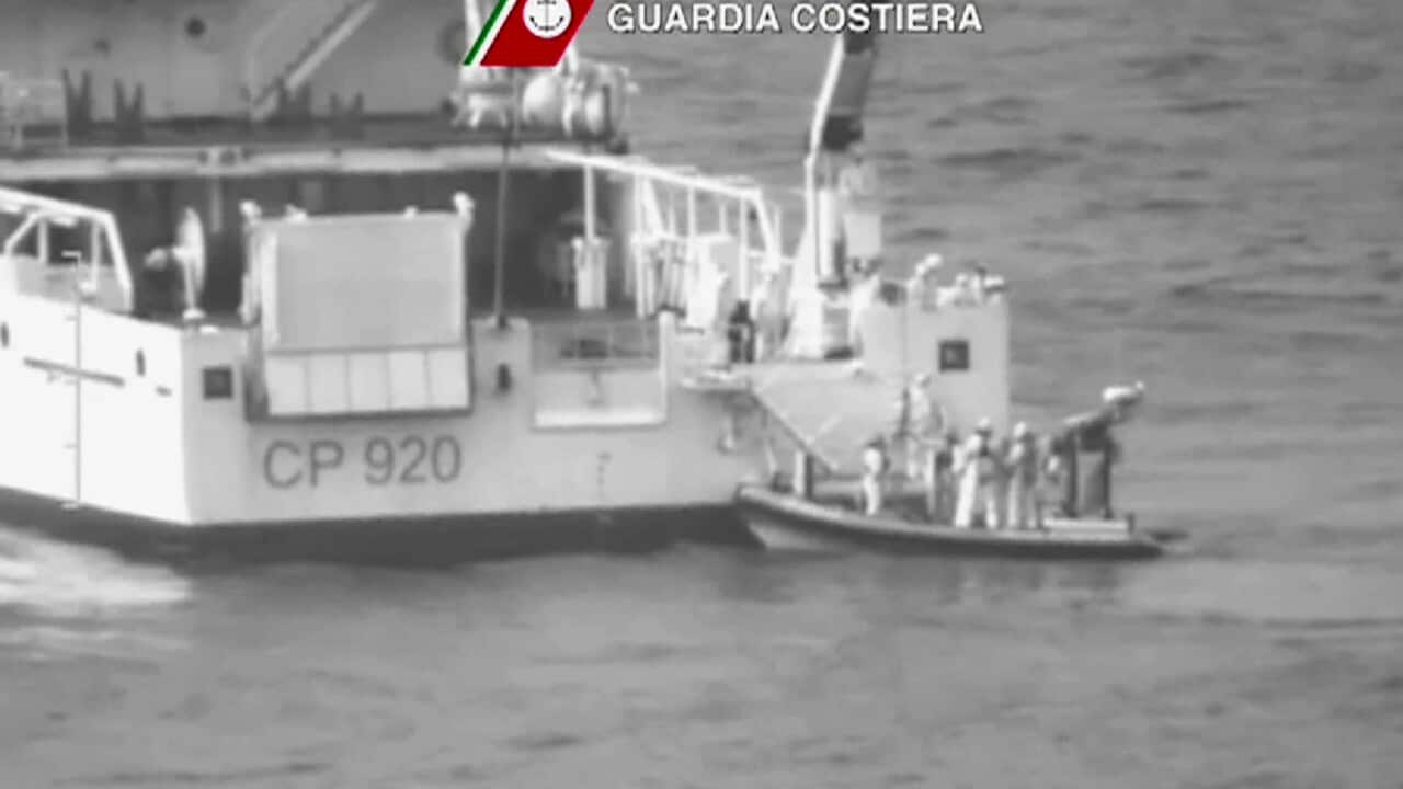 An Italian coast Guard vessel during ongoing search and rescue operation in the Mediterranean Sea south of the Italian island of Lampedusa, Sunday April 19, 2015 (Guardia Costiera via AP)
