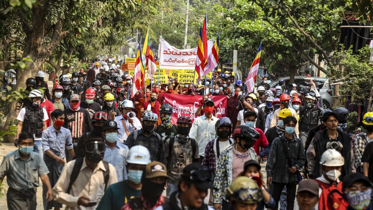 epa09067393 Demonstrators carry placards during a protest against the military coup in Mandalay, Myanmar, 11 March 2021. Anti-coup protests continue in Myanmar amid intensifying violent crackdowns on demonstrators by security forces. EPA/STRINGER