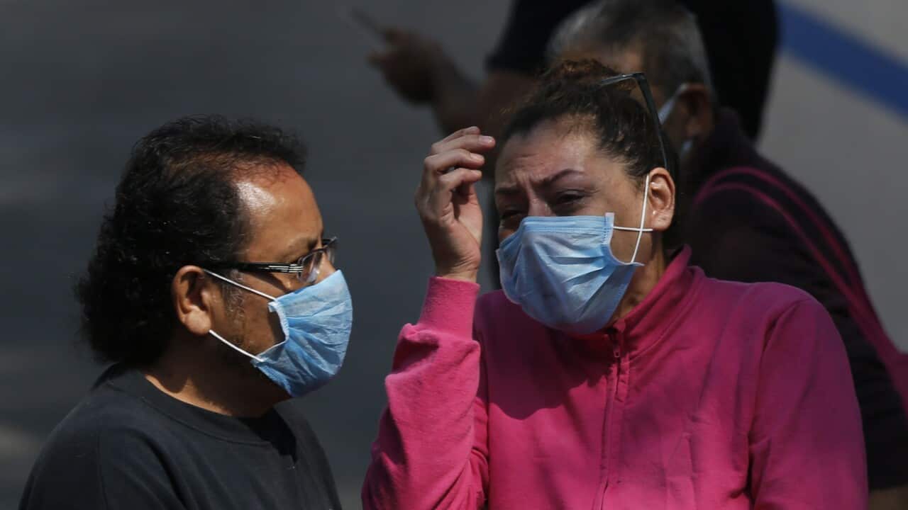 A woman cries outside the Parque de Los Venados hospital in Mexico City