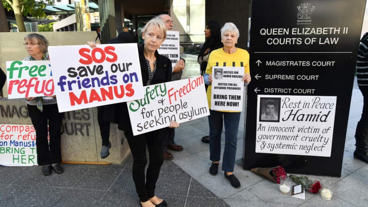 Refugee Action Collective protesters hold a vigil for deceased asylum seeker Hamid Khazaei outside Brisbane Magistrates Court