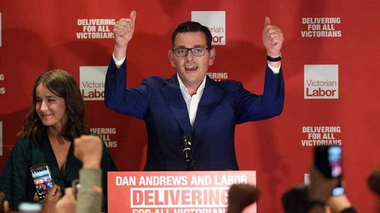 Daniel Andrews reacts as he arrives during the Labor Party reception at the Village Green in Mulgrave on Victorian State election night in Melbourne.