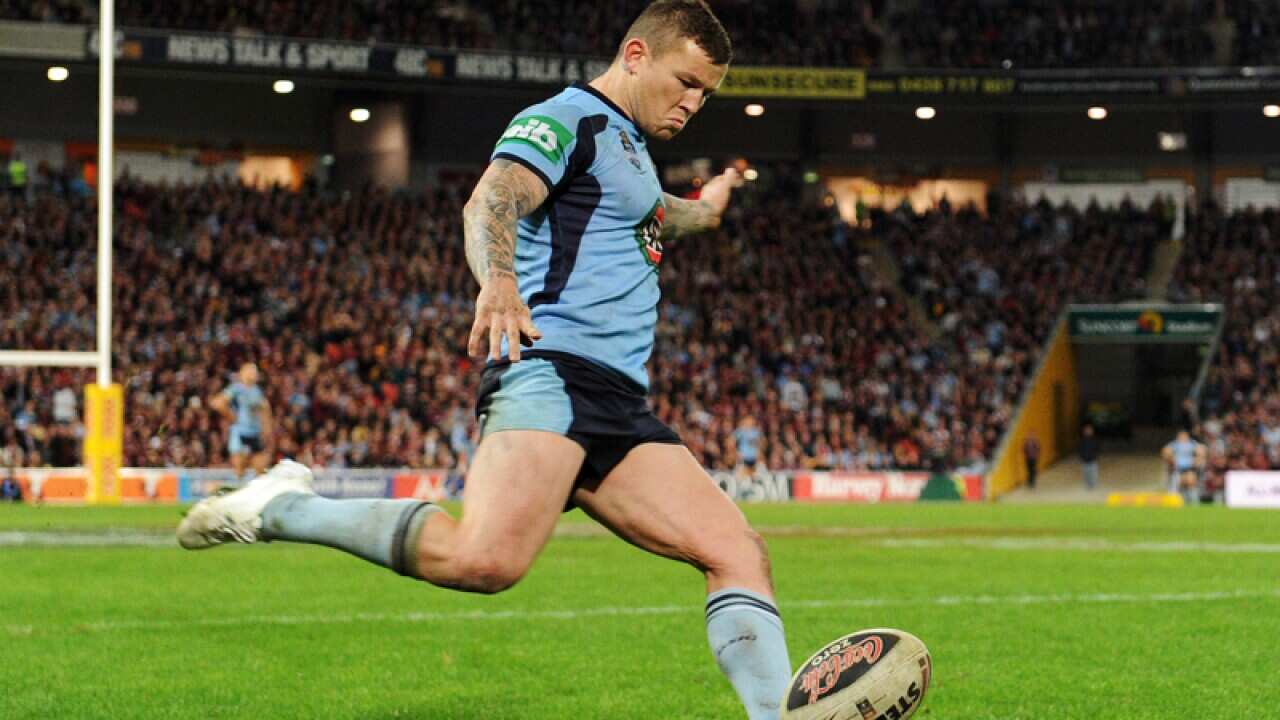 New South Wales player Todd Carney kicks a conversion.