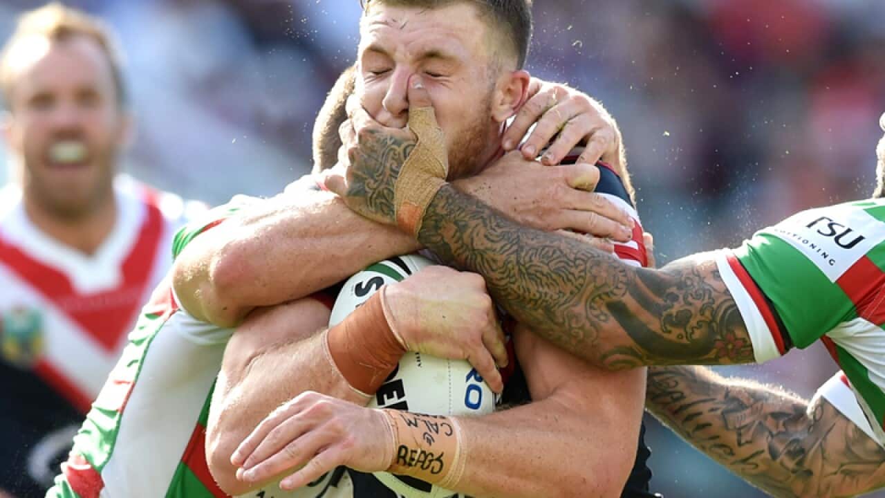 Jackson Hastings (centre) of the Roosters