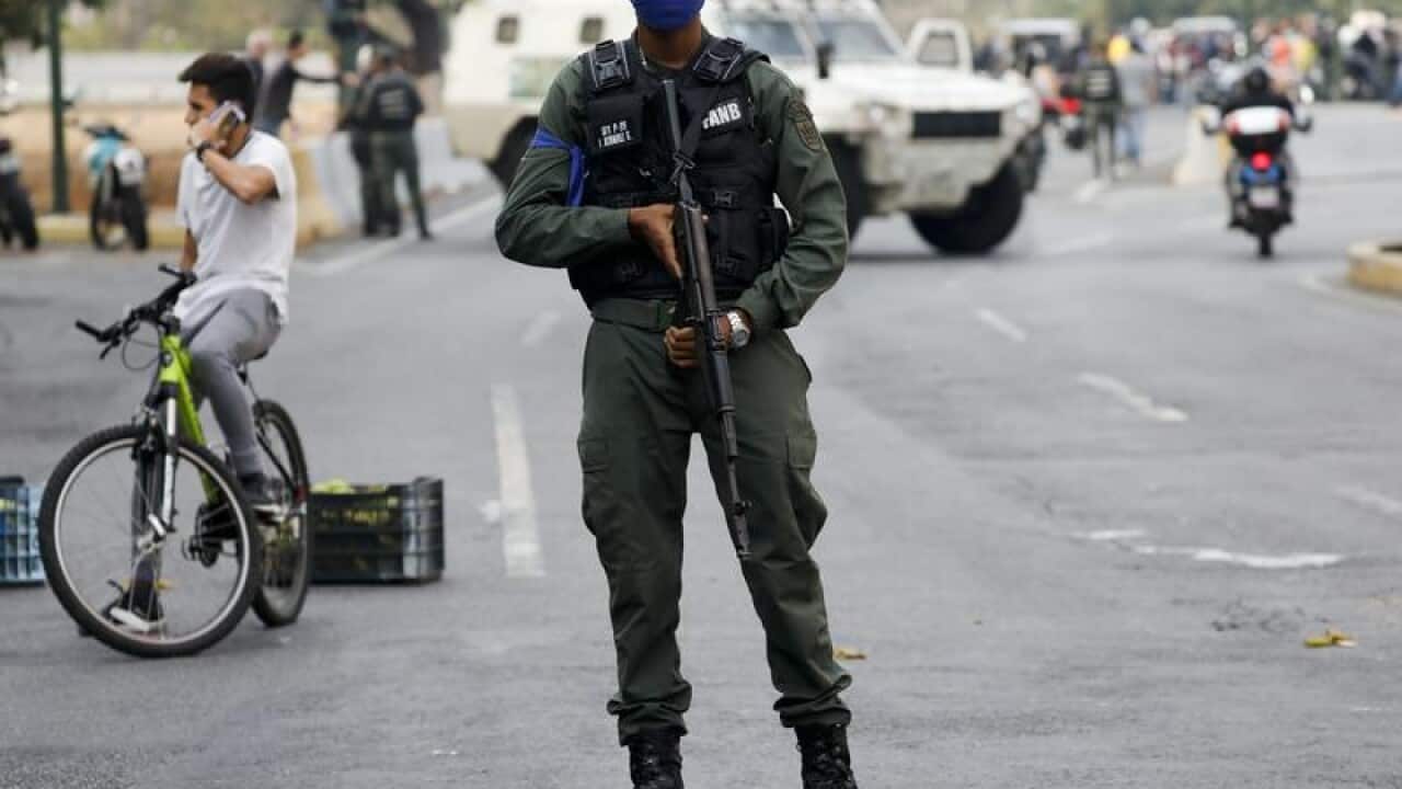 A soldier on guard near La Carlota air base in Venezuela.