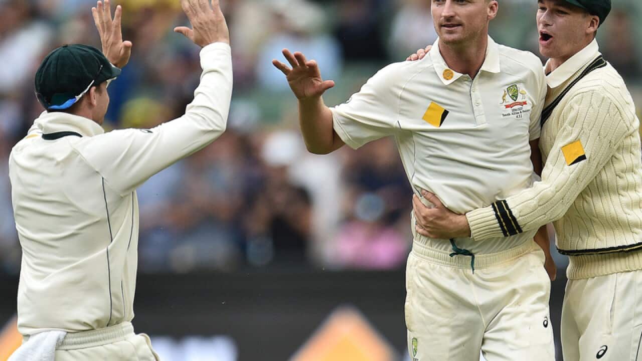 Australian bowler Jackson Bird (C) reacts after claiming a wicket