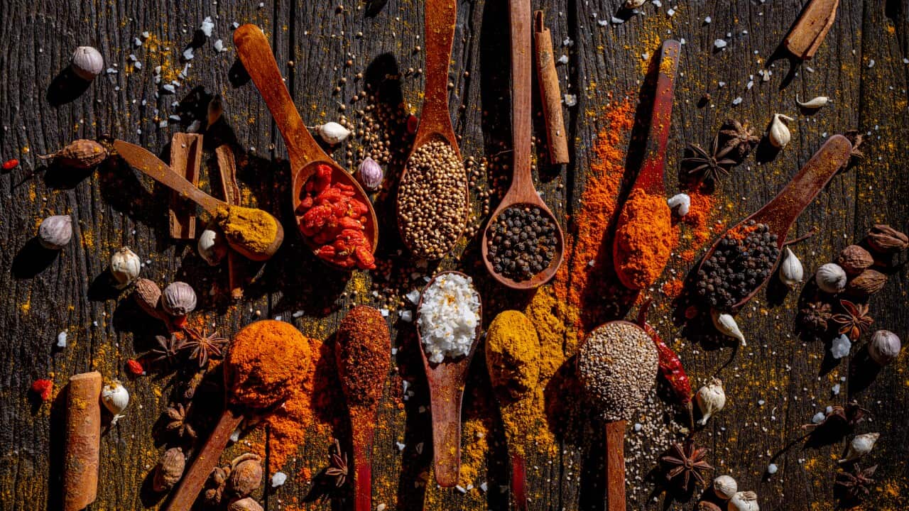 Aromatic Symphony: Spices and Herbs on Rustic Wooden Background