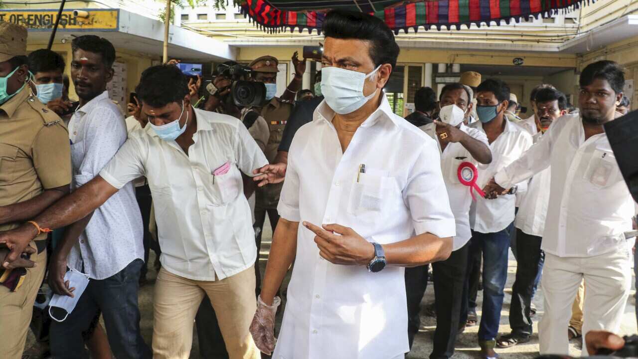 Dravida Munnetra Kazhagam party chief Muthuvel Karunanidhi Stalin displays his ink mark after casting his vote in the Tamil Nadu state assembly elections in Chennai,India, Tuesday,April 6, 2021. (AP Photo/R.Parthibhan)