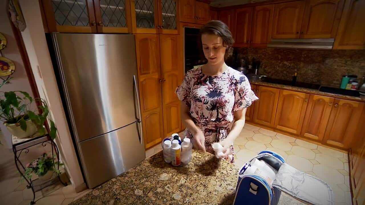 Natasha Cauchi preparing to take medication